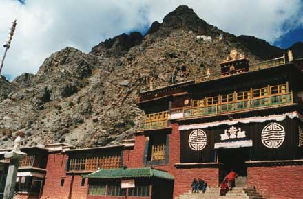 The kora and hermitages high above the monastery.