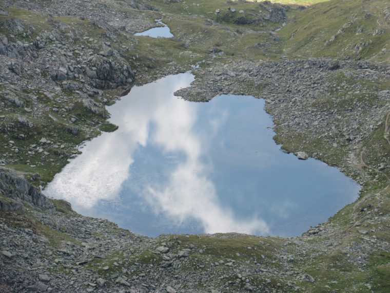 Austria Stubai Alps, Stubaier Hohenweg (Runde Tour), path beside sky-reflecting tarn, above Sulzenau Hut, Walkopedia