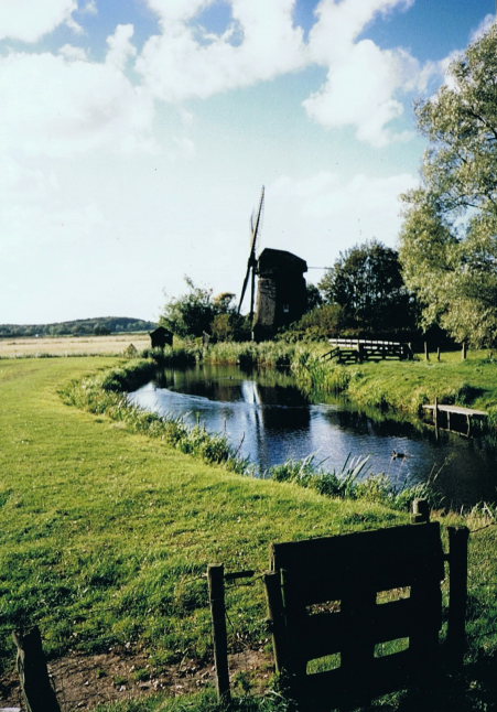 Netherlands North, Greater Friesland Path, a mill just behind the dunes , Walkopedia