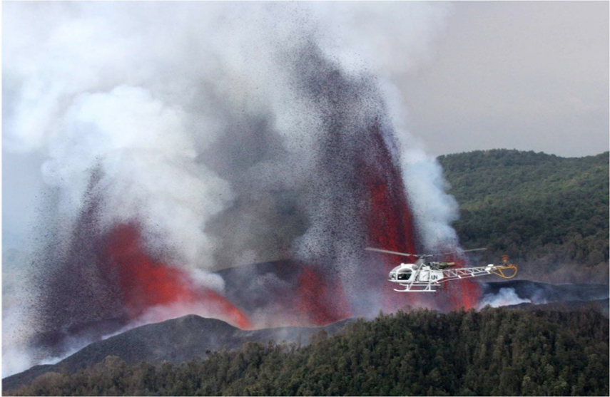 Rwanda, Virunga Mountains, aircrew prepares to land inside the Nyamuragira volcano crater, Walkopedia