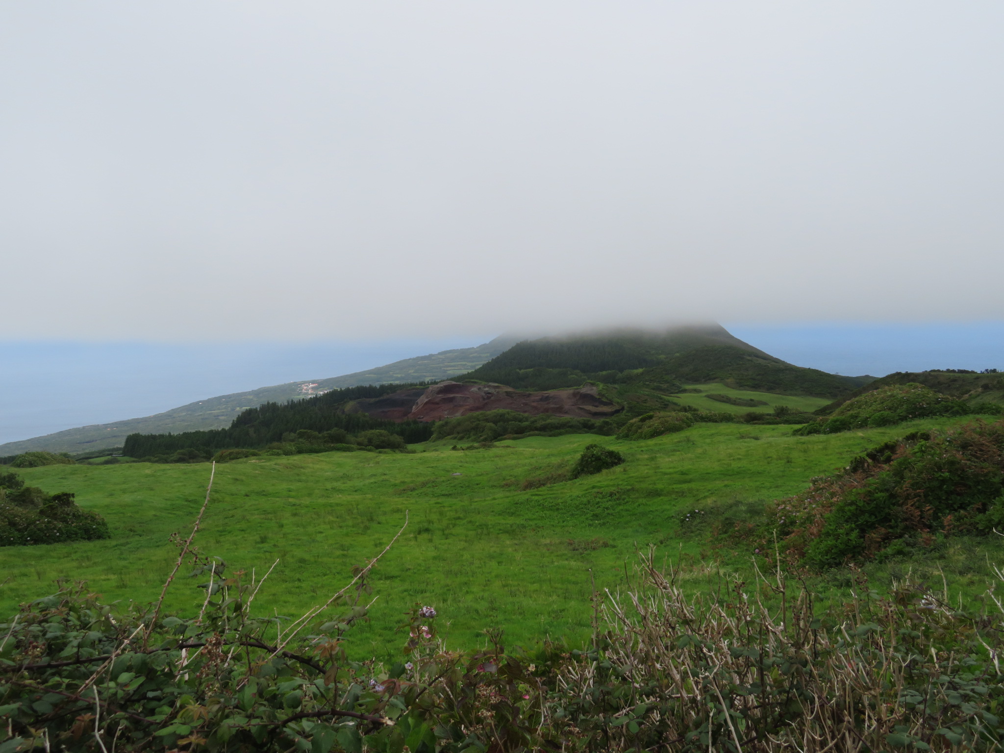 Portugal Azores, Ten Volcanoes Trail, Faial,  Coming below the cloud, looking down peninsula, Cabeco do Fogo, Walkopedia