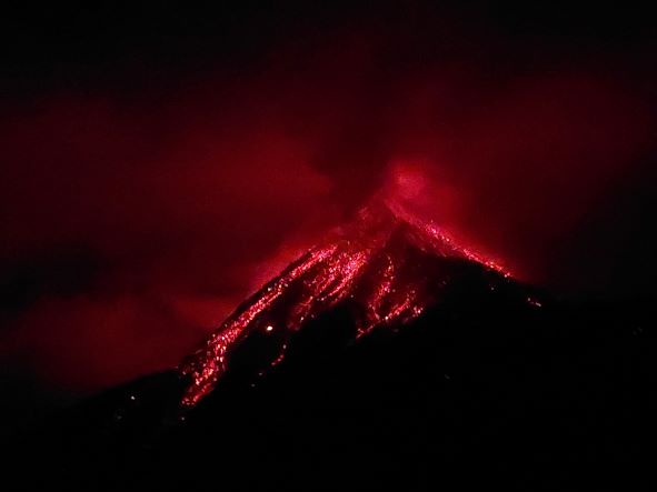 Volcan Acatenango and Volcan Fuego: Fuego eruping at night - © William Mackesy