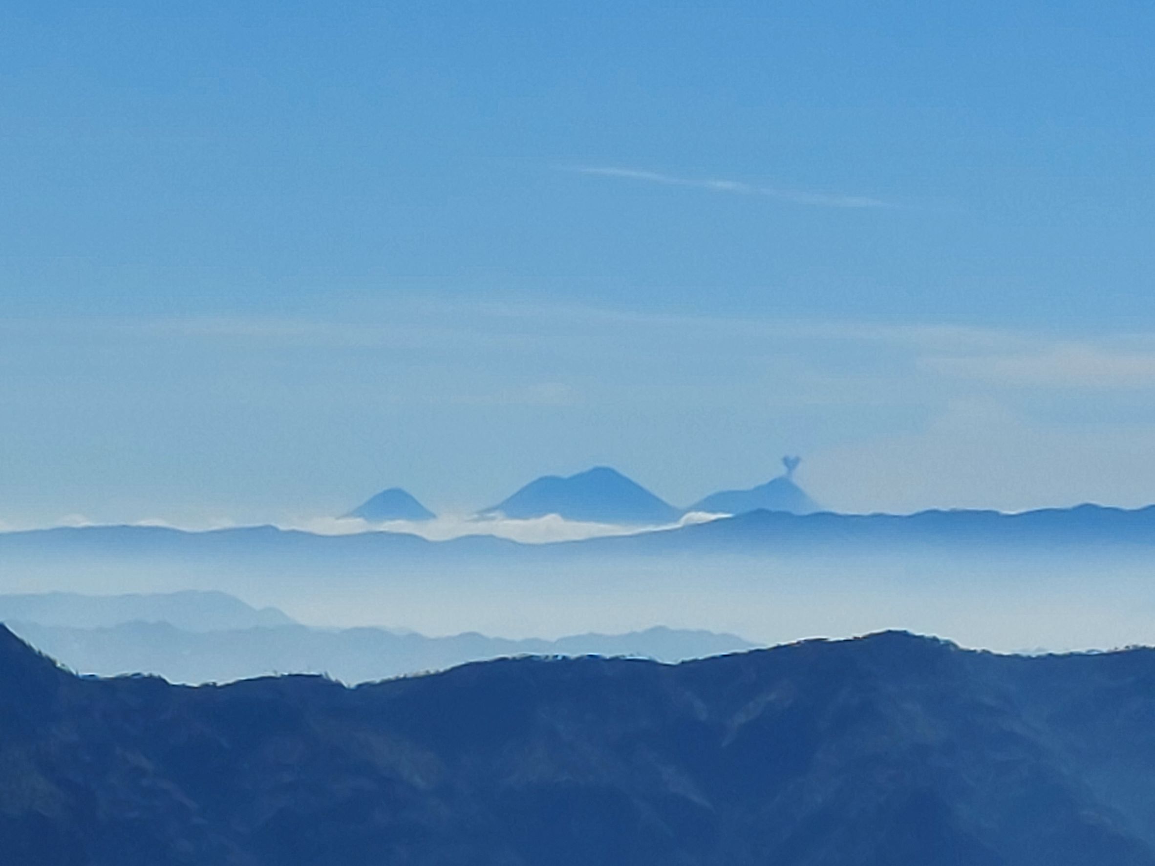 Guatemala Western Volcanic Highlands, Guatemalas Amazing Volcanoes, Fuego belching, from Tajumulco, Walkopedia