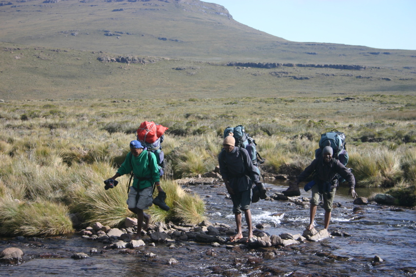 South Africa Drakensberg, North Drakensberg Traverse, Our porters crossing a stream, Walkopedia