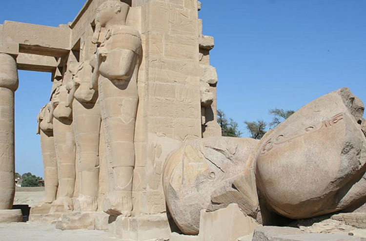 Egypt, To the Valley of the Kings, And near them on the sand the shattered visage lies... Ramesseum - © From Flickr user NinaHale, Walkopedia
