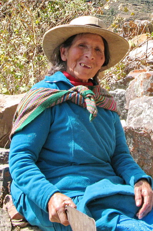 Peru North Huayhuash, Huayhuash Circuit, Woman in blue w machete outside Llamac-Kestrel, Walkopedia