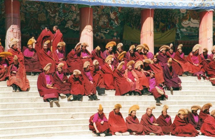 Tibet's Monastery Koras: Labrang - gathering for prayers, spring sun - © William Mackesy