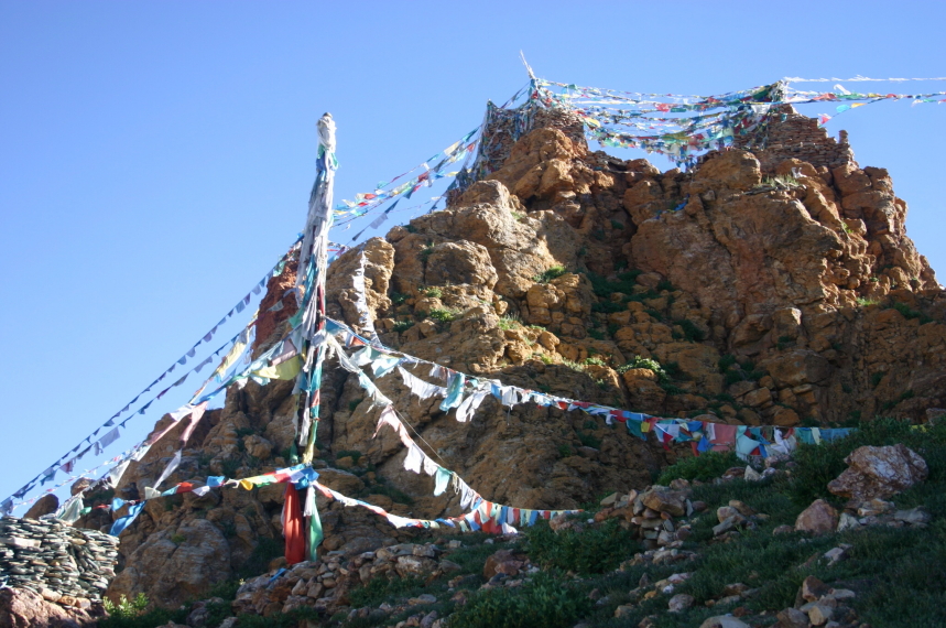 China Tibet, Lake Manasarovar, Prayer flags above cliff-top monastery, Walkopedia