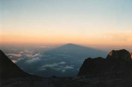 Mt Kinabalu: Mt Kinabalu - The Mountain's shadow at sunrise. - © William Mackesy